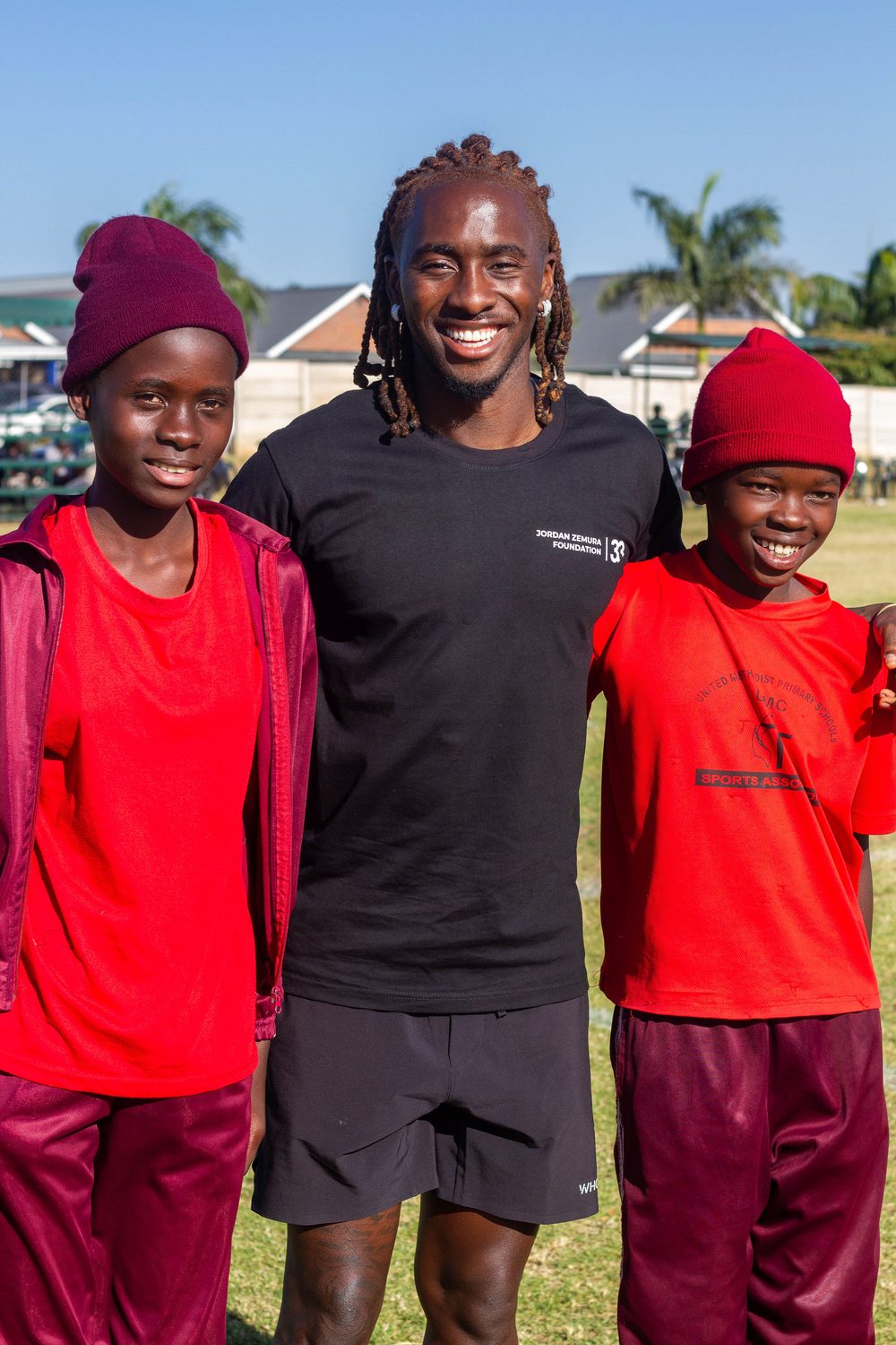 Jordan Zemura with young players